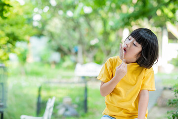 asian girl eating ice cream with blur background