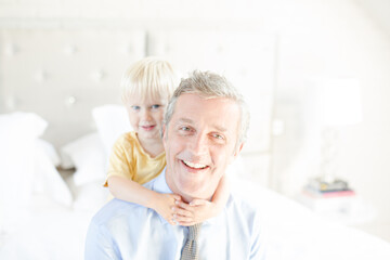 Father and son hugging on bed