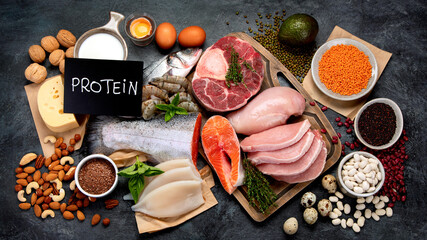 Natural sources of protein on dark background.