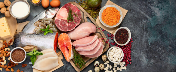 Natural sources of protein on dark background.