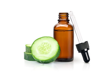 Cucumber essential extract  oil serum with cucumber slices isolated on white background.