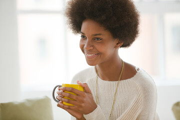 Smiling woman sitting in living room