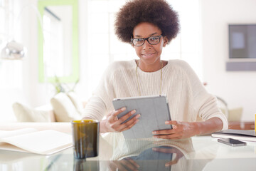 Fototapeta na wymiar Woman using digital tablet at table