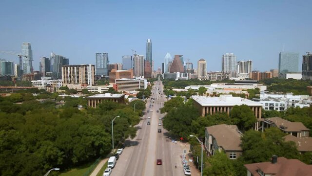Aerial view of Soco district leading to Congress Avenue Bridge over town lake in downtown Austin Texas, drone 4K