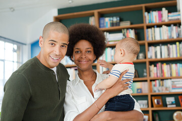 Family smiling together in living room