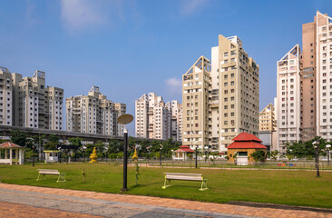 City road with high rise residential apartment buildings at Kolkata India	