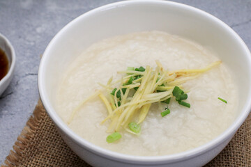 Rice porridge or Congee with fresh ginger and coriander, is a favorite breakfast for south east asian people.