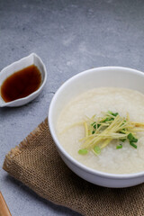 Rice porridge or Congee with fresh ginger and coriander, is a favorite breakfast for south east asian people.