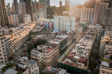 Aerial angle of Colorful messy rooftop on dense old residential house in Kowloon, Hong Kong