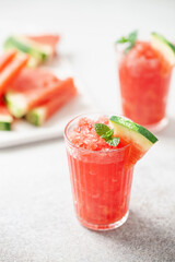Refreshing cold summer drink watermelon slushie with mint in glass