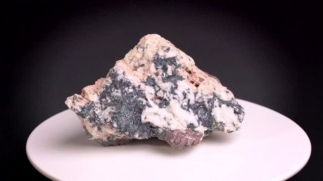 Some shots of a hematite quartz mineral, with gray, black and white color. About 10 centimeters in size. Mineral found in the south of France.