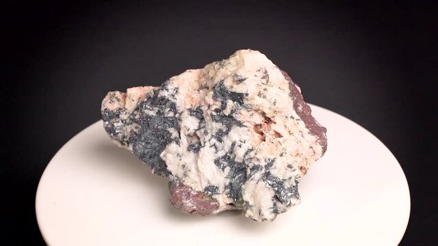 Some shots of a hematite quartz mineral, with gray, black and white color. About 10 centimeters in size. Mineral found in the south of France.