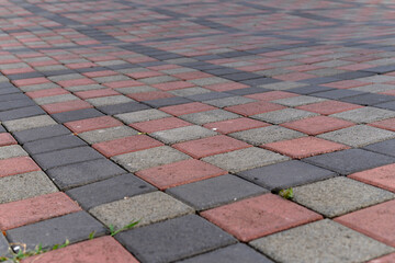 Fototapeta premium Paving stones. Concept of laying paving slabs and pavers. Paving stones. Concrete pavement blocks. can be used as background and wallpaper