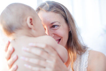 Mother playing with baby boy