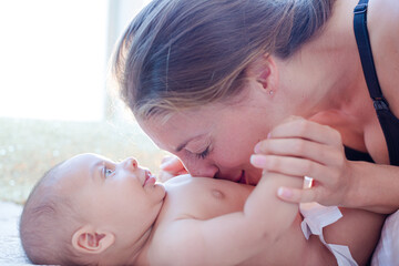 Mother playing with baby boy