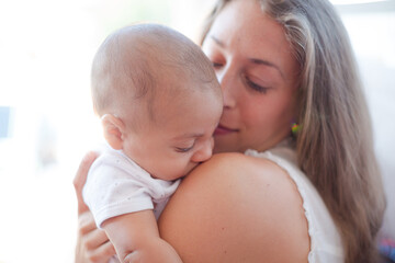 Mother holding baby boy