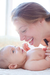 Mother playing with baby boy