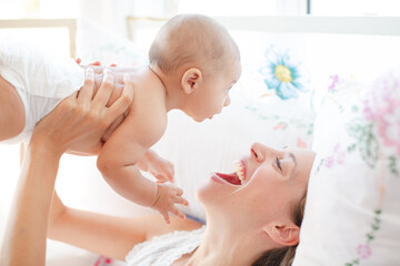 Mother playing with baby boy