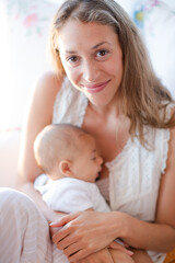 Fototapeta na wymiar Mother breast-feeding baby boy