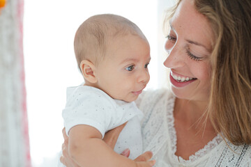 Mother holding baby boy