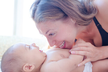 Mother playing with baby boy