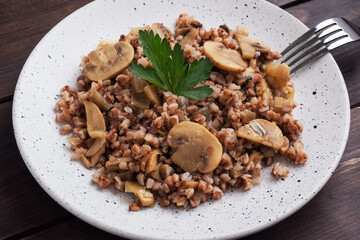 Boiled buckwheat with stewed mushrooms. Russian traditional food. Healthy diet food. copy space, top view.