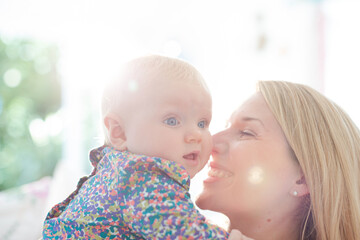 Mother holding baby girl