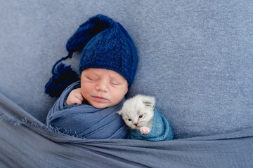 Newborn sleeping with kitten © tan4ikk