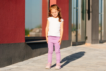 little girl in white t-shirt. space for your logo or design. Mockup for print