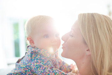 Mother holding baby girl