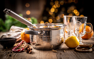 Steel pot and ingredients for mulled wine