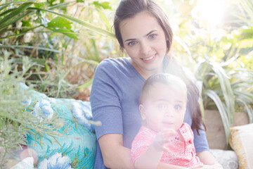 Mother holding baby girl