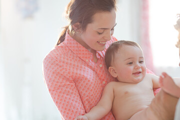 Parents playing with baby boy