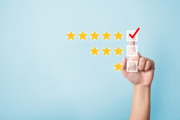 Hand choose to rating score five star icons. Customer service experience and business satisfaction...