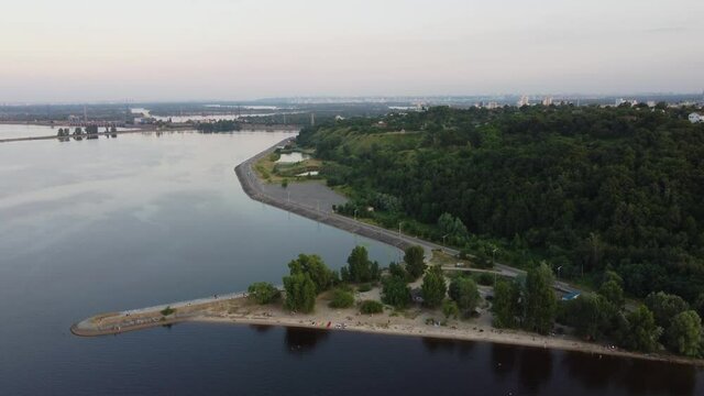 Drone view of a small beach in summer among a green neighbourhood of Vyshgorod