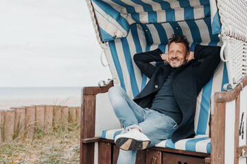 Middle-aged man enjoying quality time at the seaside