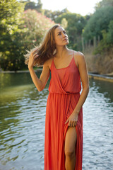 Woman standing by pool outdoors