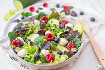 healthy summer salad with berries and feta cheese