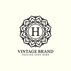 luxurious mandala vintage letter H vector logo design