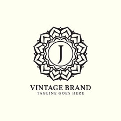 luxurious mandala vintage letter J vector logo design
