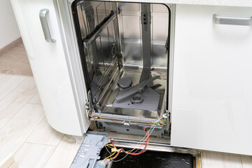dishwasher door removed for repair, breakdown of kitchen appliances