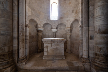Symmetrical view of a circular niche in a Roman church containing a small stone altar