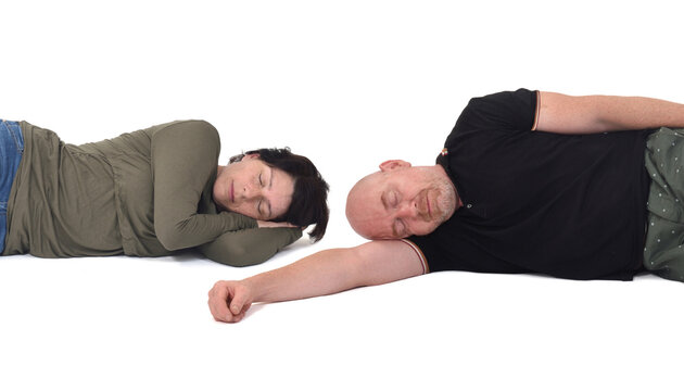 closeup of a couple lying on the floor over white background