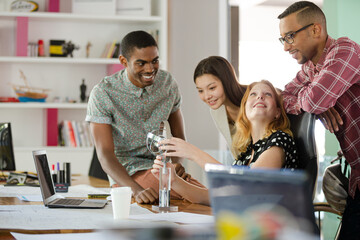 People examining model in office