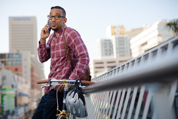 Man talking on cell phone on city street