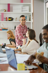 Man eating and working at conference tablet