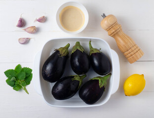 Middle Eastern cuisine-babaganush (eggplant caviar) from baked eggplant, garlic, tahini, lemon, olive oil, mint. Step-by-step recipe.