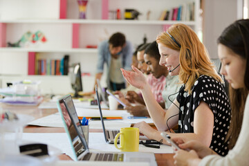 People working at conference table in office