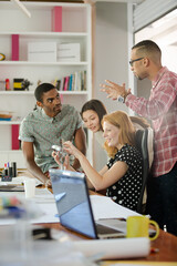 People examining model in office
