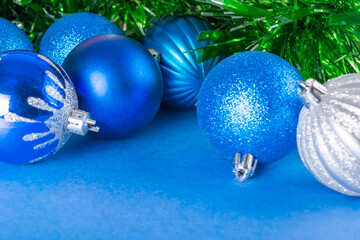 Christmas decoration blue and silver festive balls and tinsel.